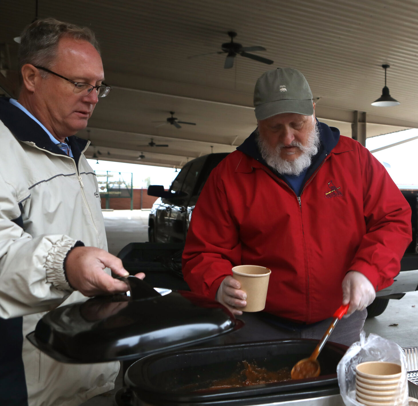 Jim Wurdack and Joe Schneider prepare chili cups